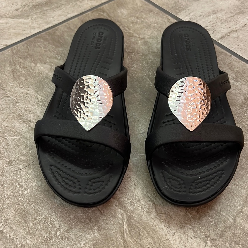 New without box. I ordered online. Too narrow for my wide feet